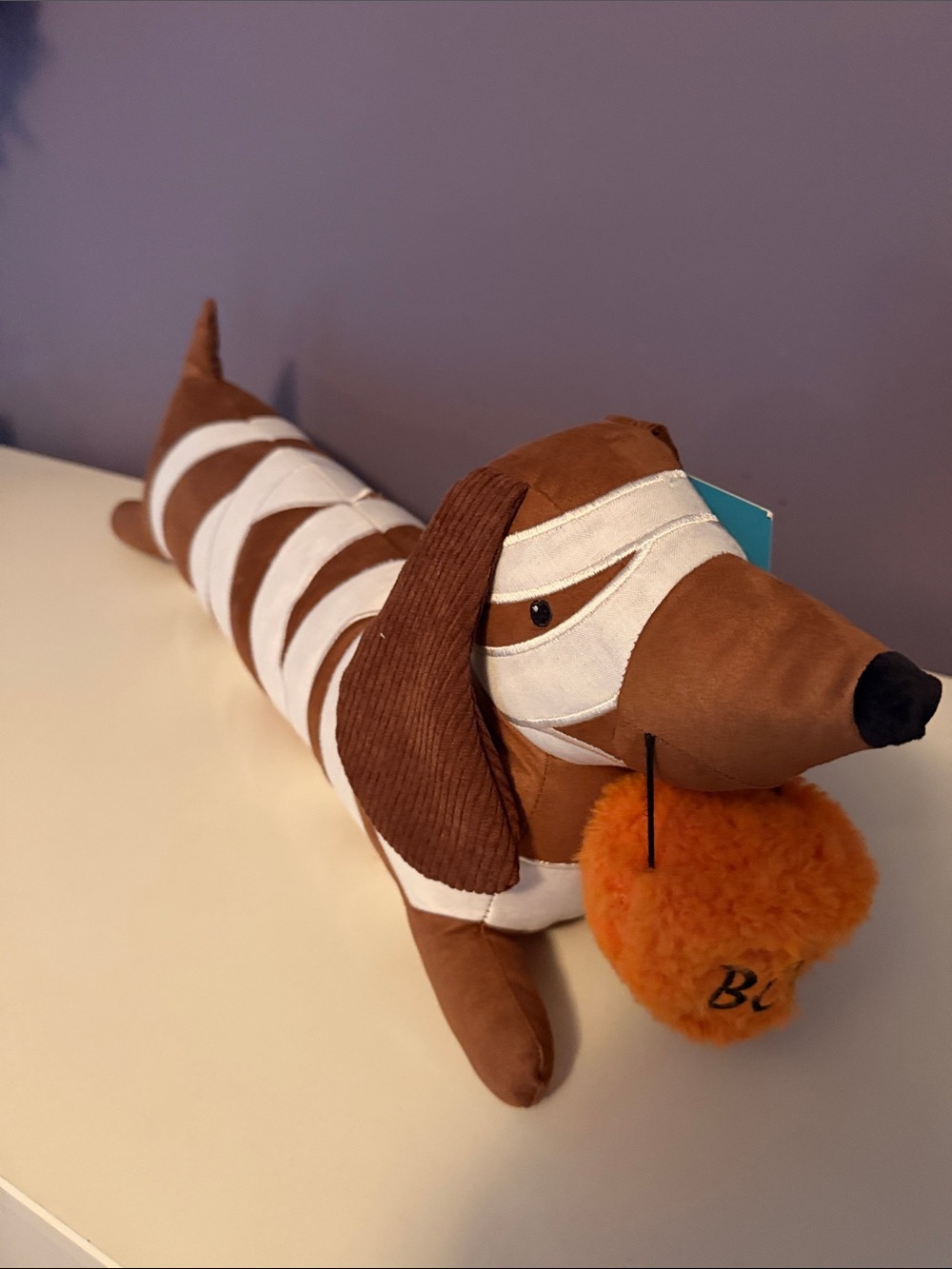 Plush Brown & White Dachshund Dog Toy with Orange Pom